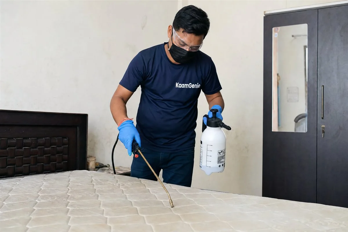 KaamGenie pest control technician treating a Dilshad Garden property in East Delhi
