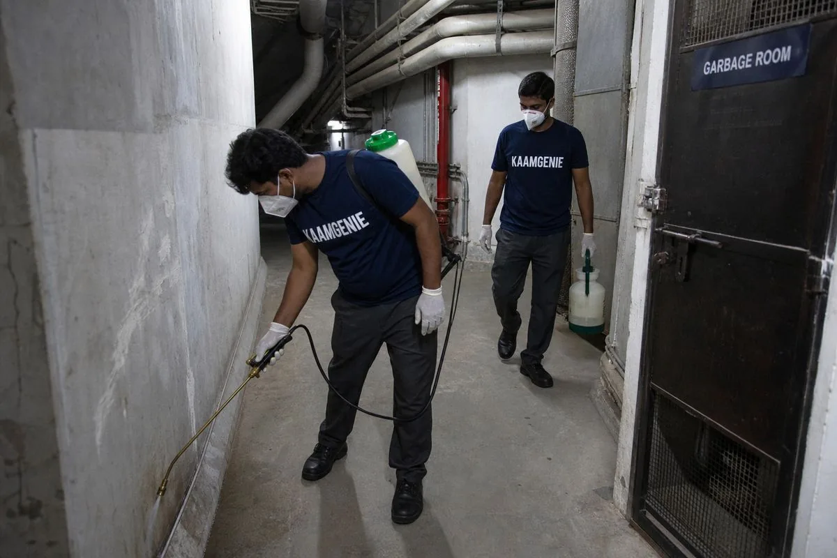 KaamGenie pest control technician treating a DLF Phase 5 property in Gurgaon