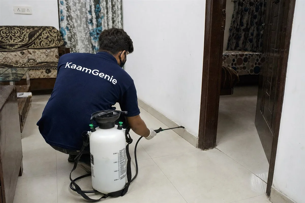 KaamGenie pest control technician treating a Dwarka Sector 11 property in West Delhi