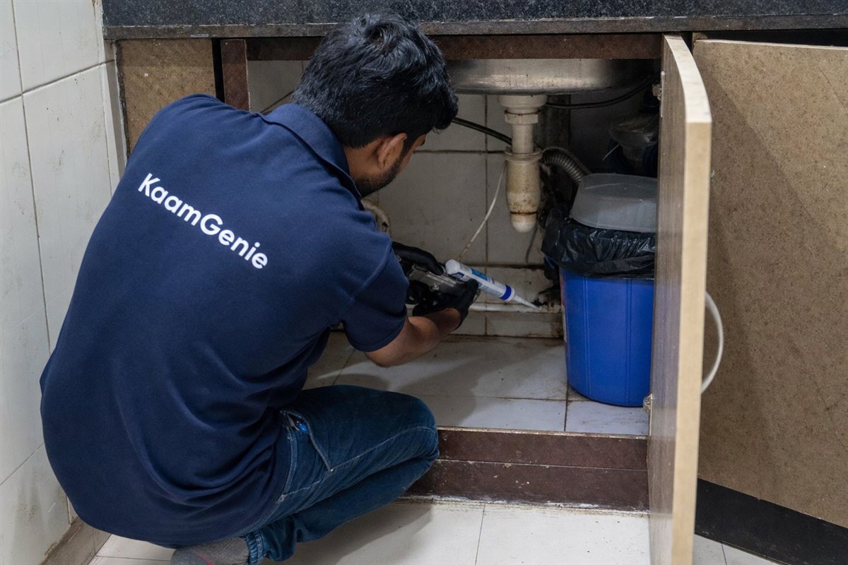KaamGenie pest control technician treating a Dwarka Sector 13 property in West Delhi