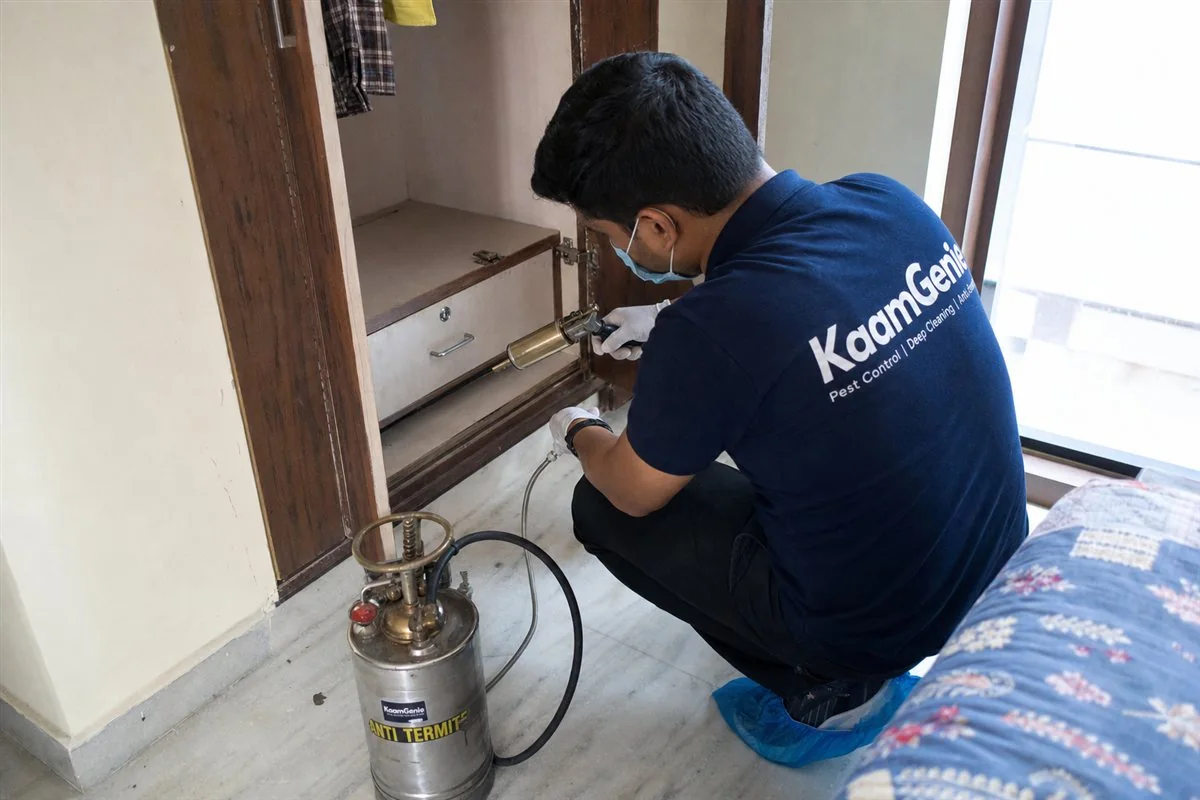KaamGenie pest control technician treating a Dwarka Sector 26 property in West Delhi
