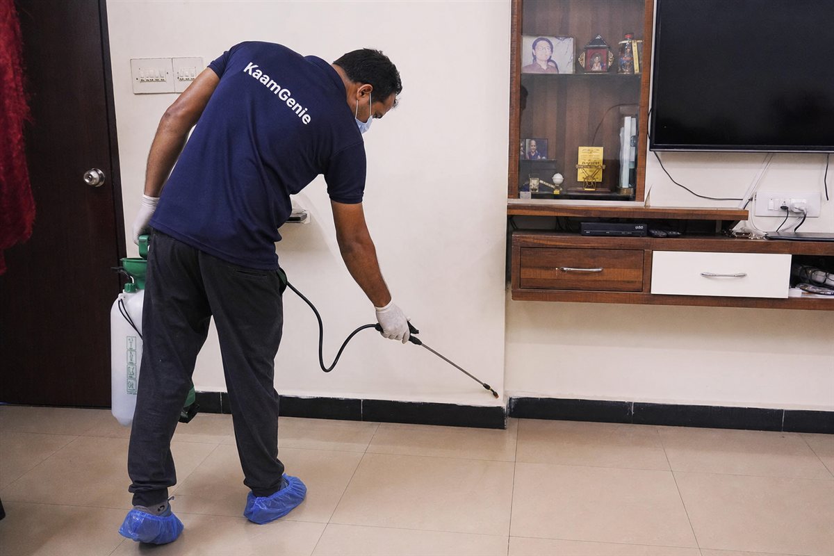 KaamGenie pest control technician treating a Dwarka Sector 5 property in West Delhi