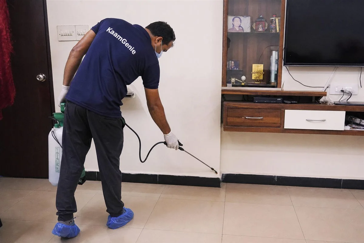 KaamGenie pest control technician treating a Dwarka Sector 5 property in West Delhi