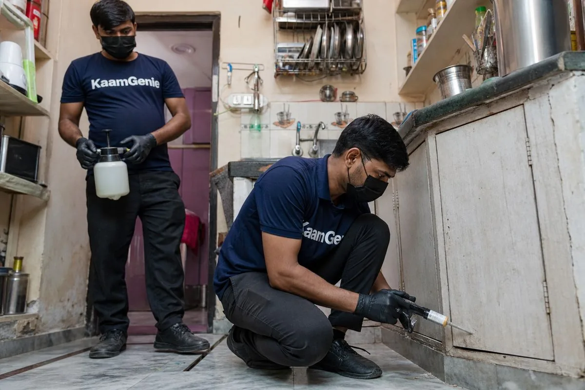 KaamGenie pest control technician treating a Gurukul Basti property in Faridabad