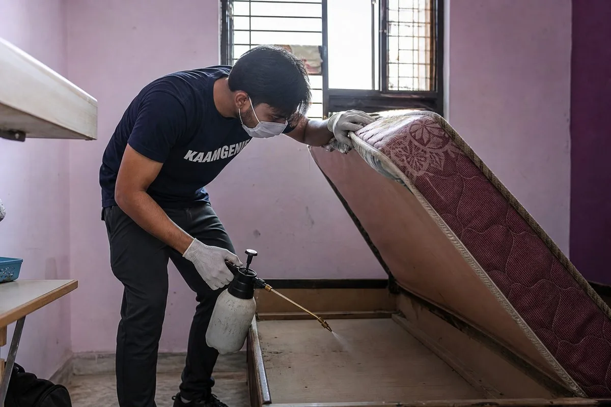 KaamGenie pest control technician treating a Jawahar Colony property in Faridabad