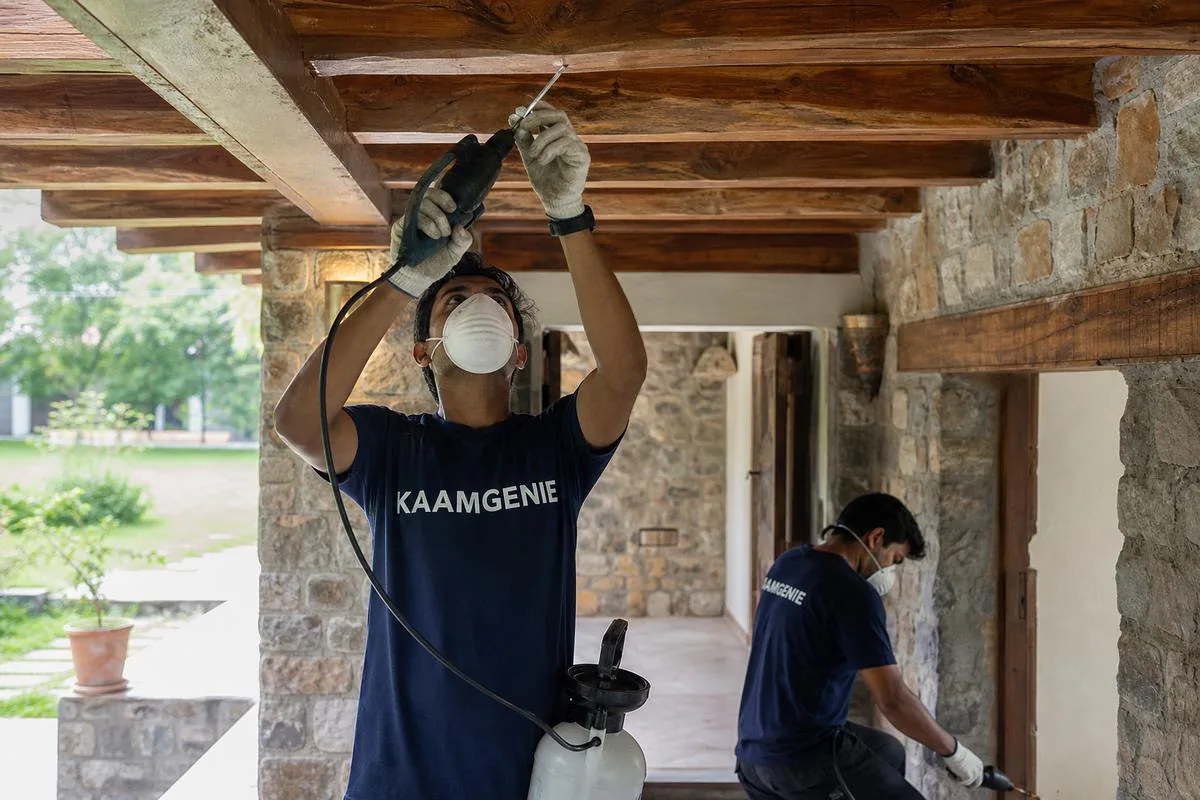 KaamGenie pest control technician treating a Lakarpur property in Faridabad