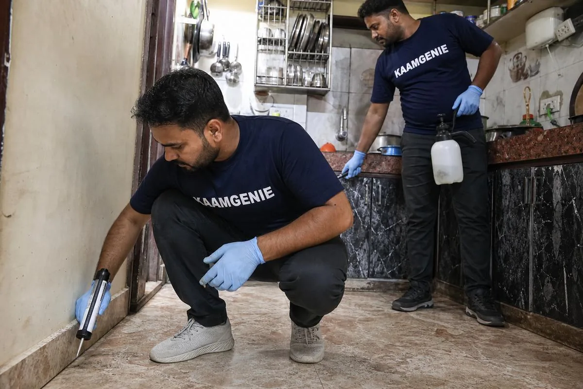 KaamGenie pest control technician treating a New Colony property in Faridabad
