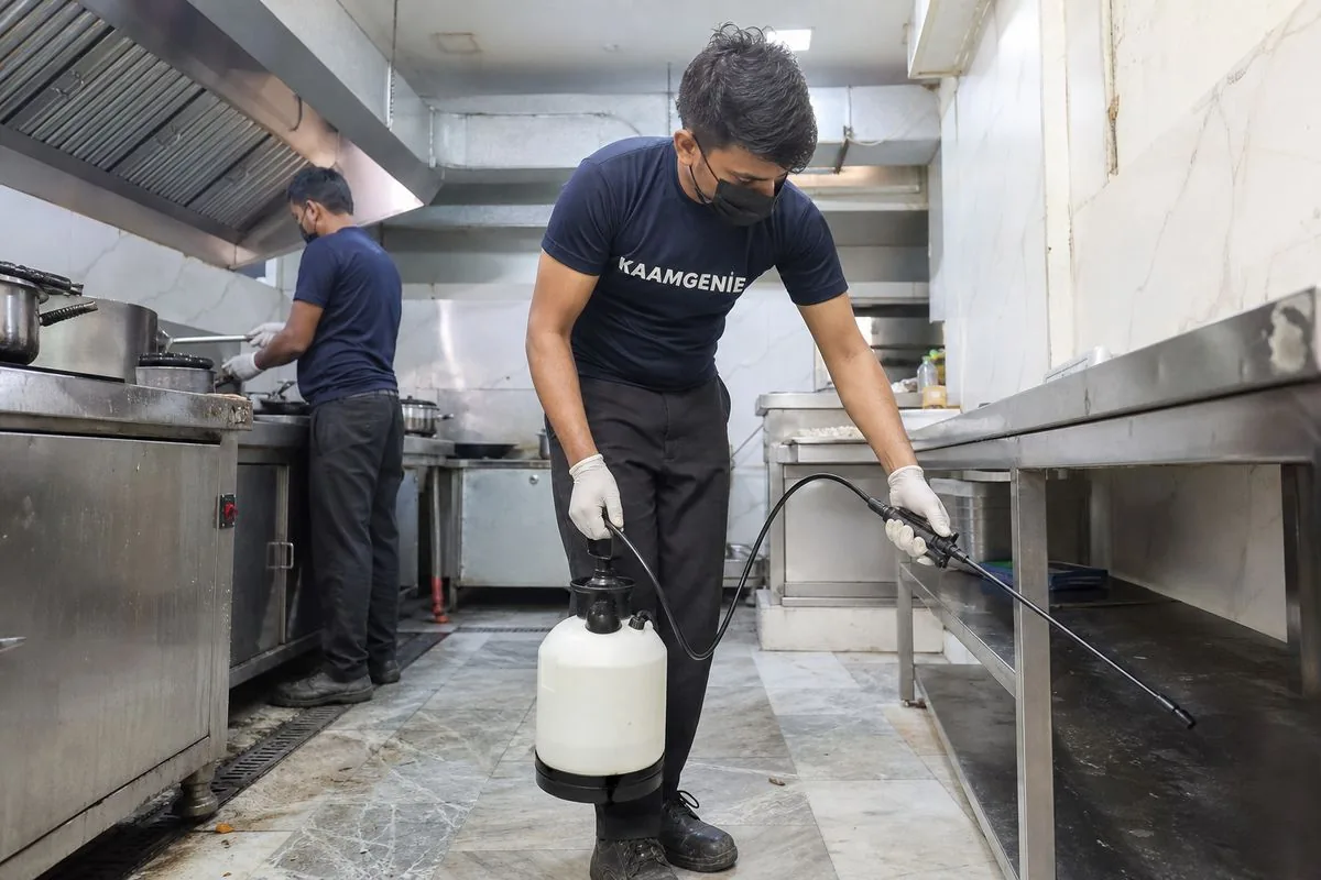 KaamGenie pest control technician treating a NIT (New Industrial Township) property in Faridabad