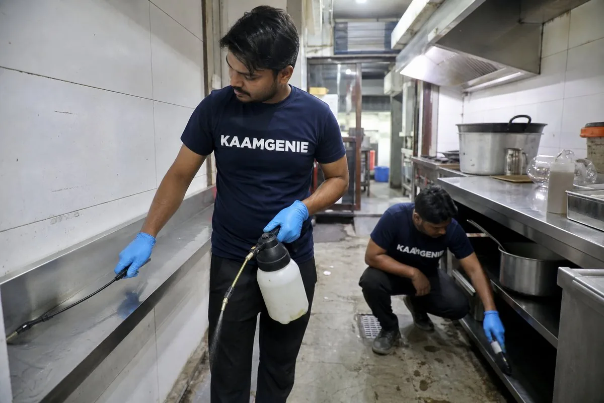 KaamGenie pest control technician treating a Sarai Khwaja property in Faridabad