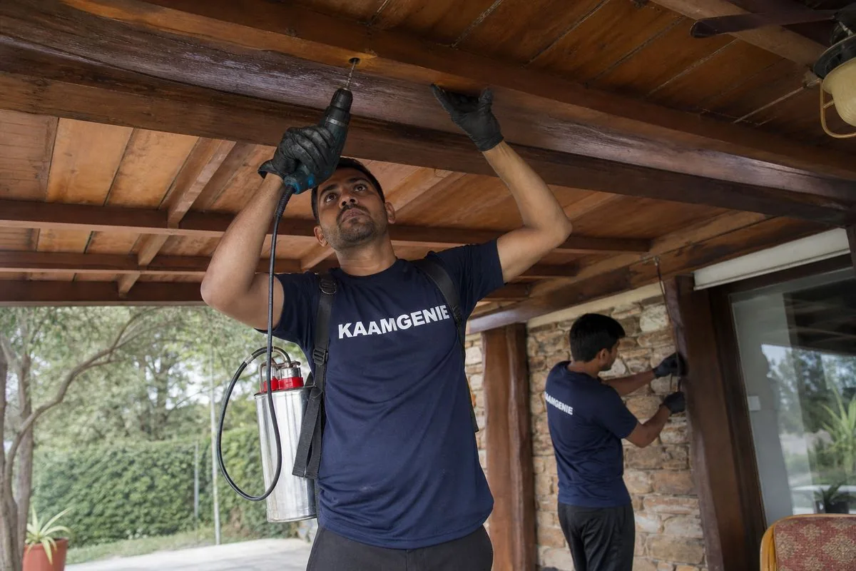 KaamGenie pest control technician treating a Surajkund property in Faridabad