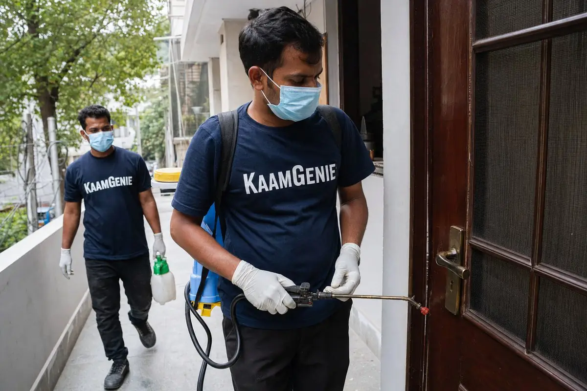 KaamGenie pest control technician treating a Freedom Fighter Enclave property in South Delhi