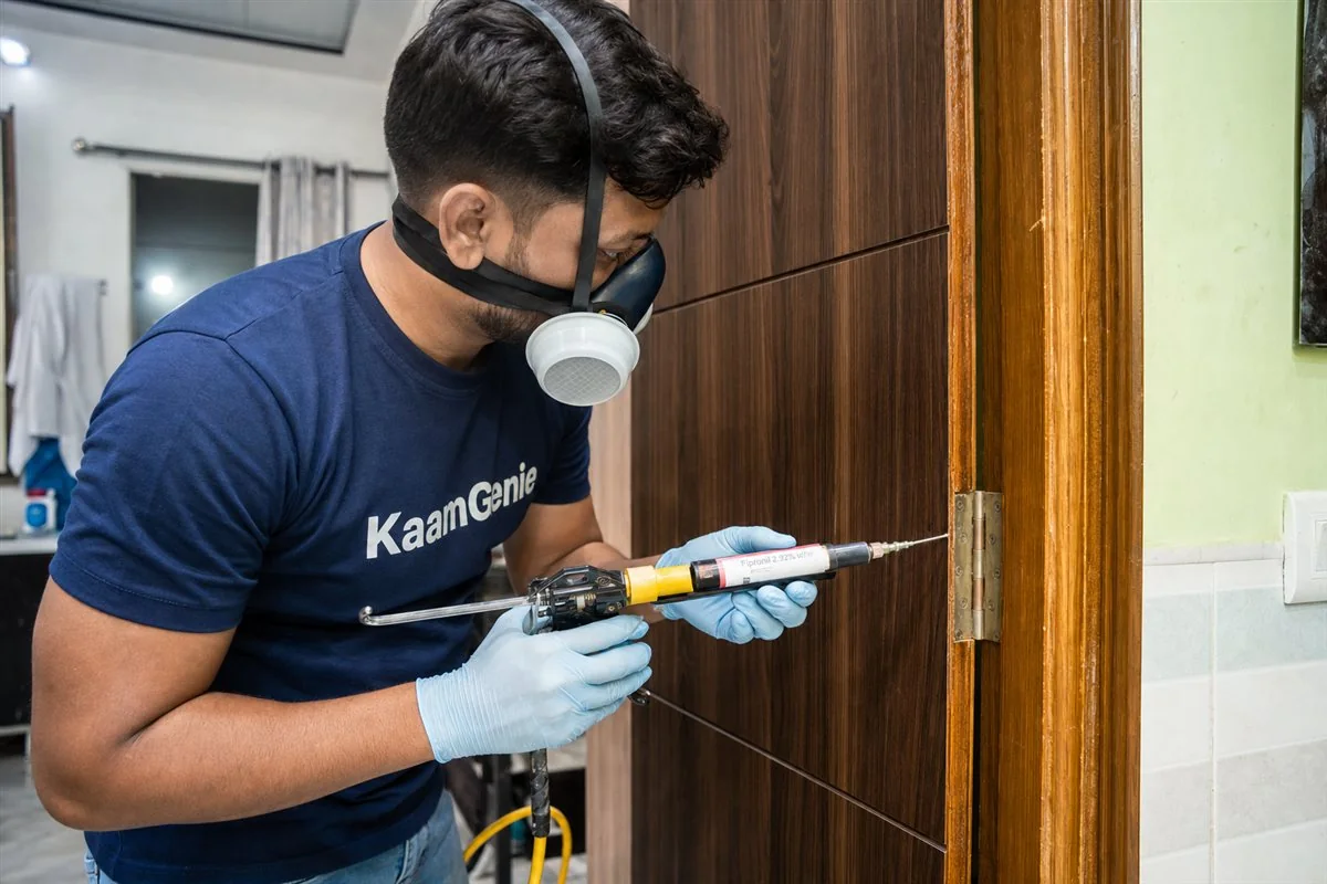KaamGenie pest control technician treating a Gandhi Nagar property in East Delhi