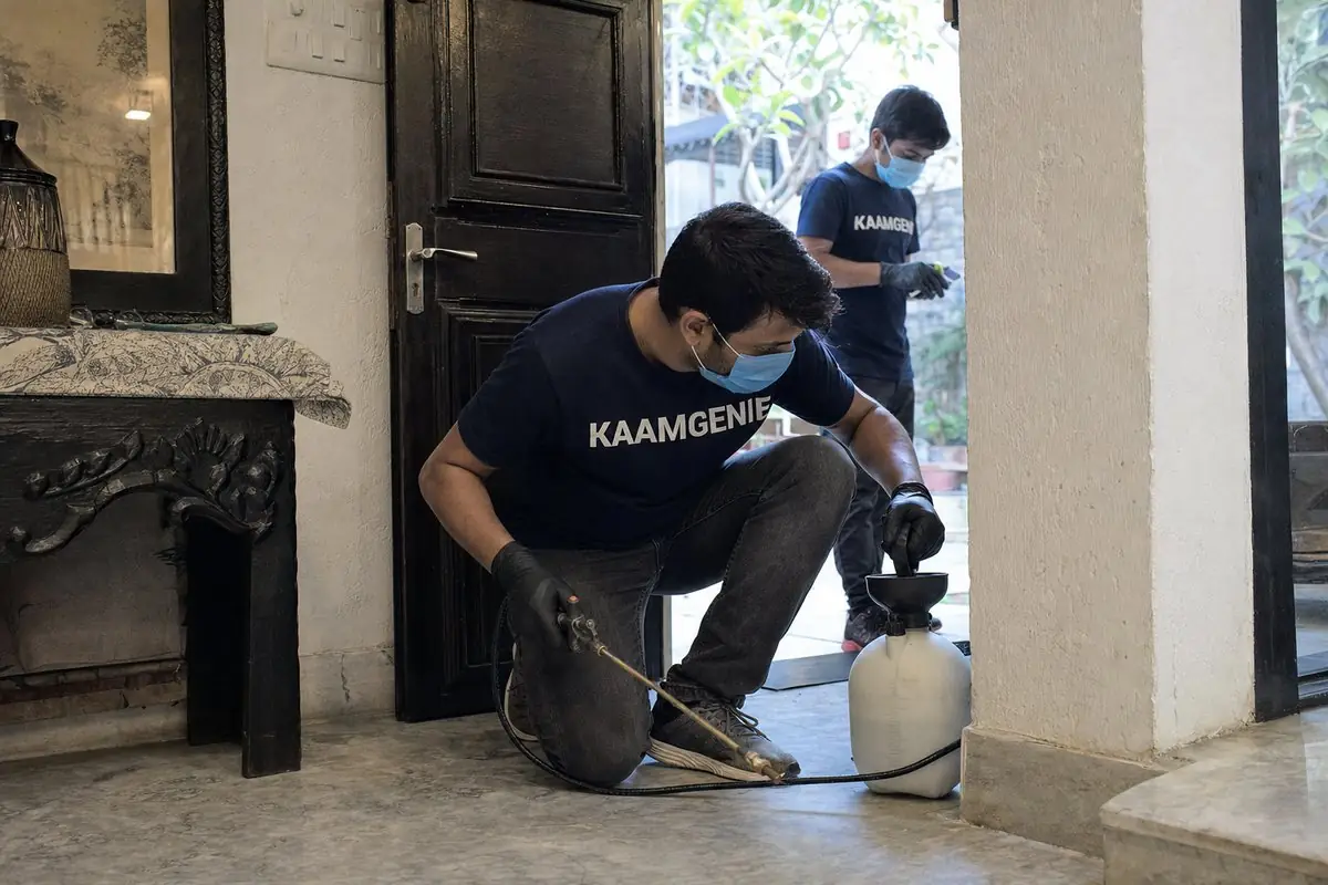 KaamGenie pest control technician treating a Garhi property in South Delhi