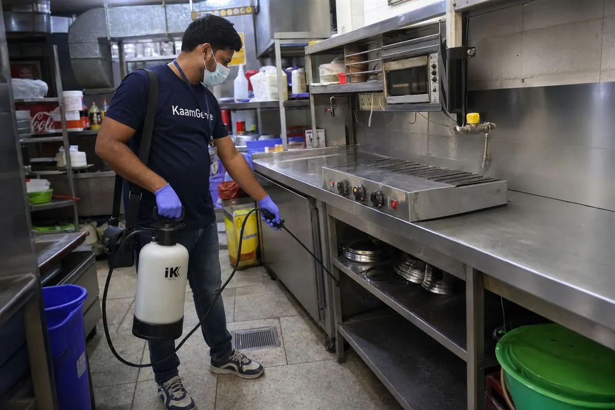 KaamGenie pest control technician treating a Ghazipur property in East Delhi