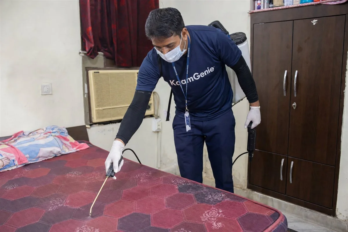 KaamGenie pest control technician treating a Gokal Puri property in East Delhi