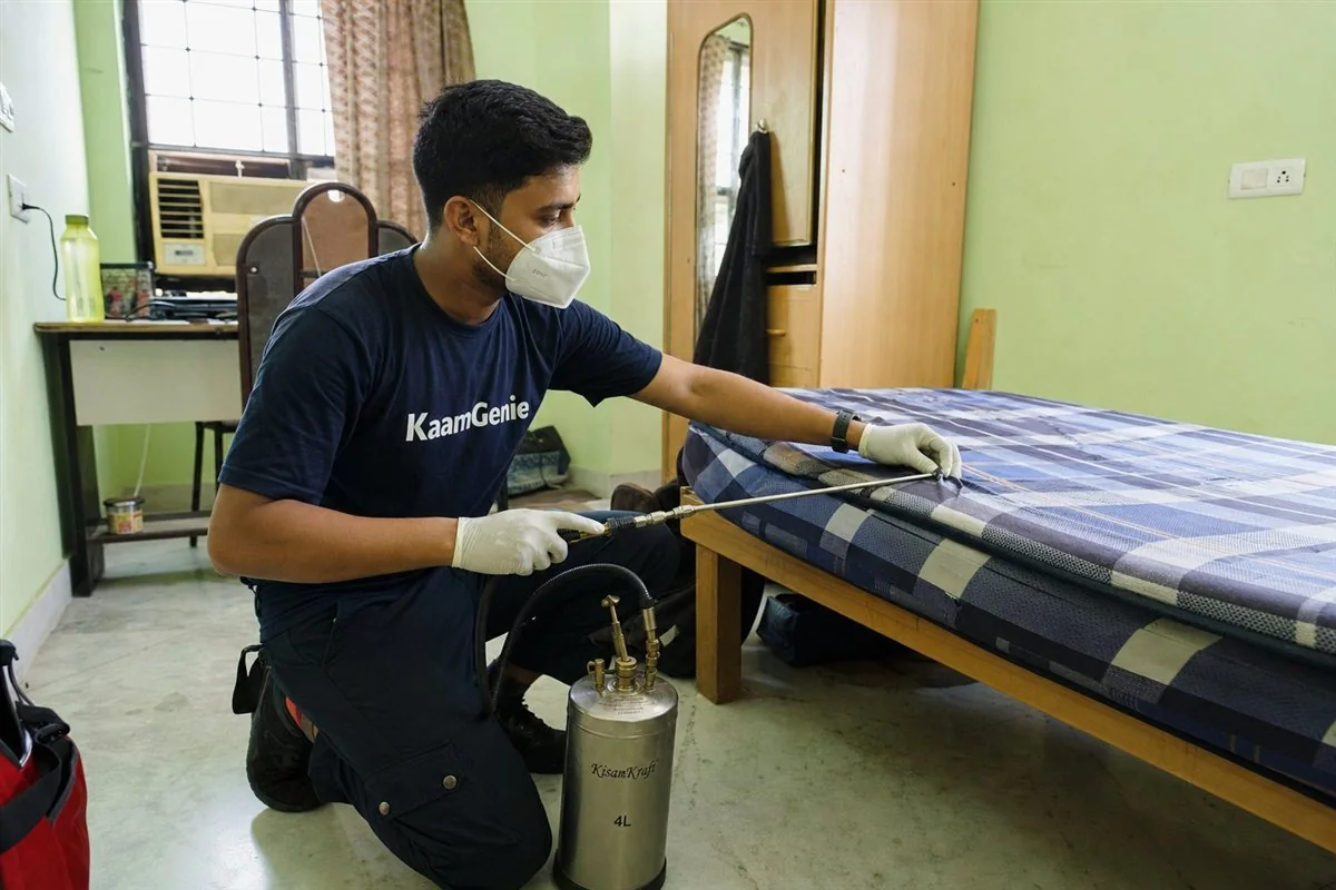 KaamGenie pest control technician treating a GTB Nagar property in North Delhi