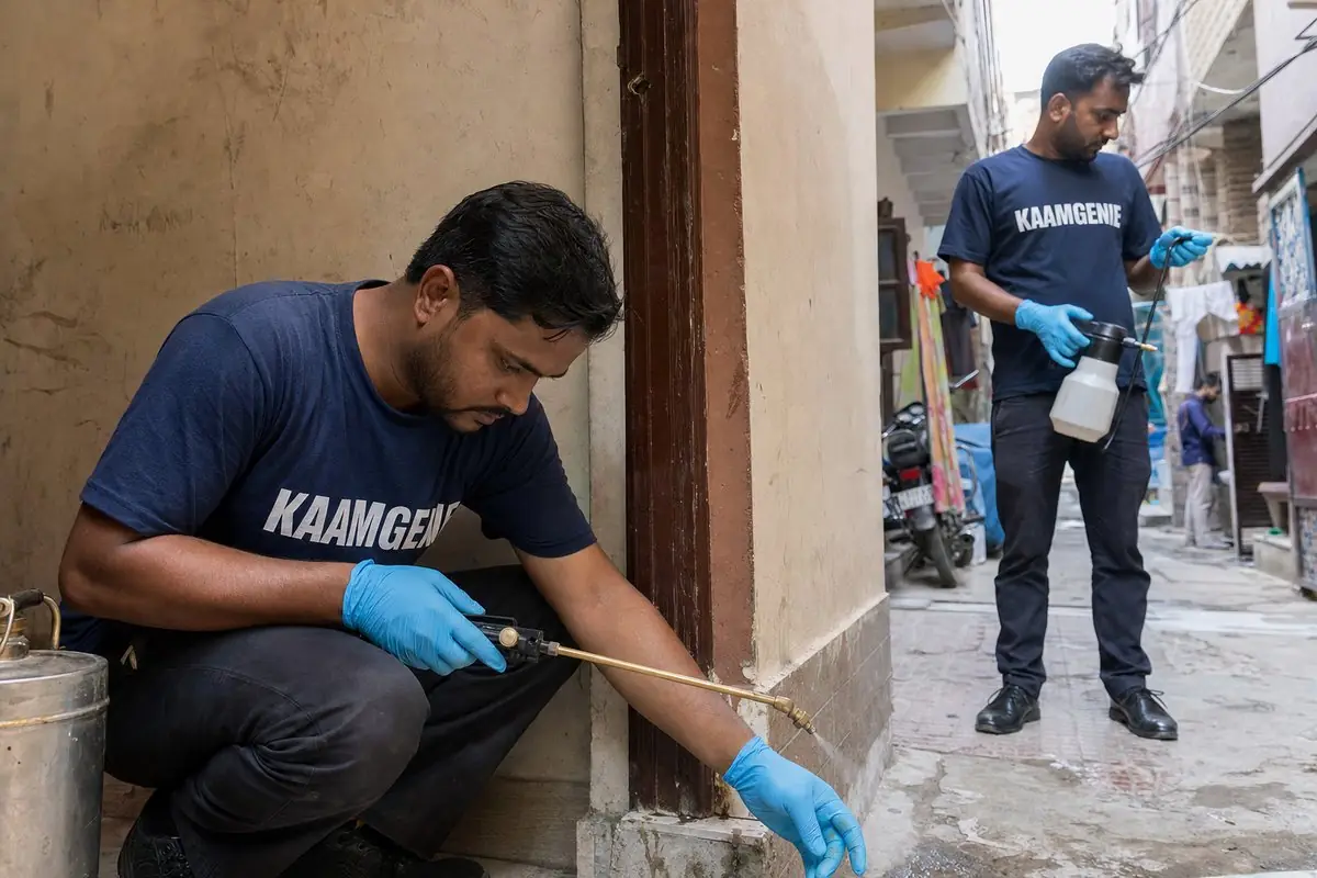 KaamGenie pest control technician treating a Hauz Rani property in South Delhi