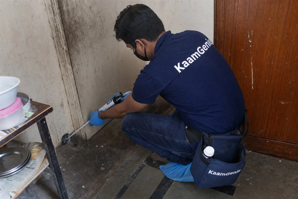 KaamGenie pest control technician treating a Inderlok property in North Delhi / Central Delhi