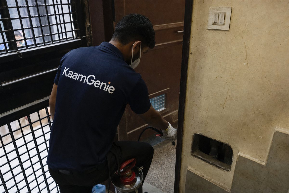 KaamGenie pest control technician treating a Jahangir Puri property in North-West Delhi