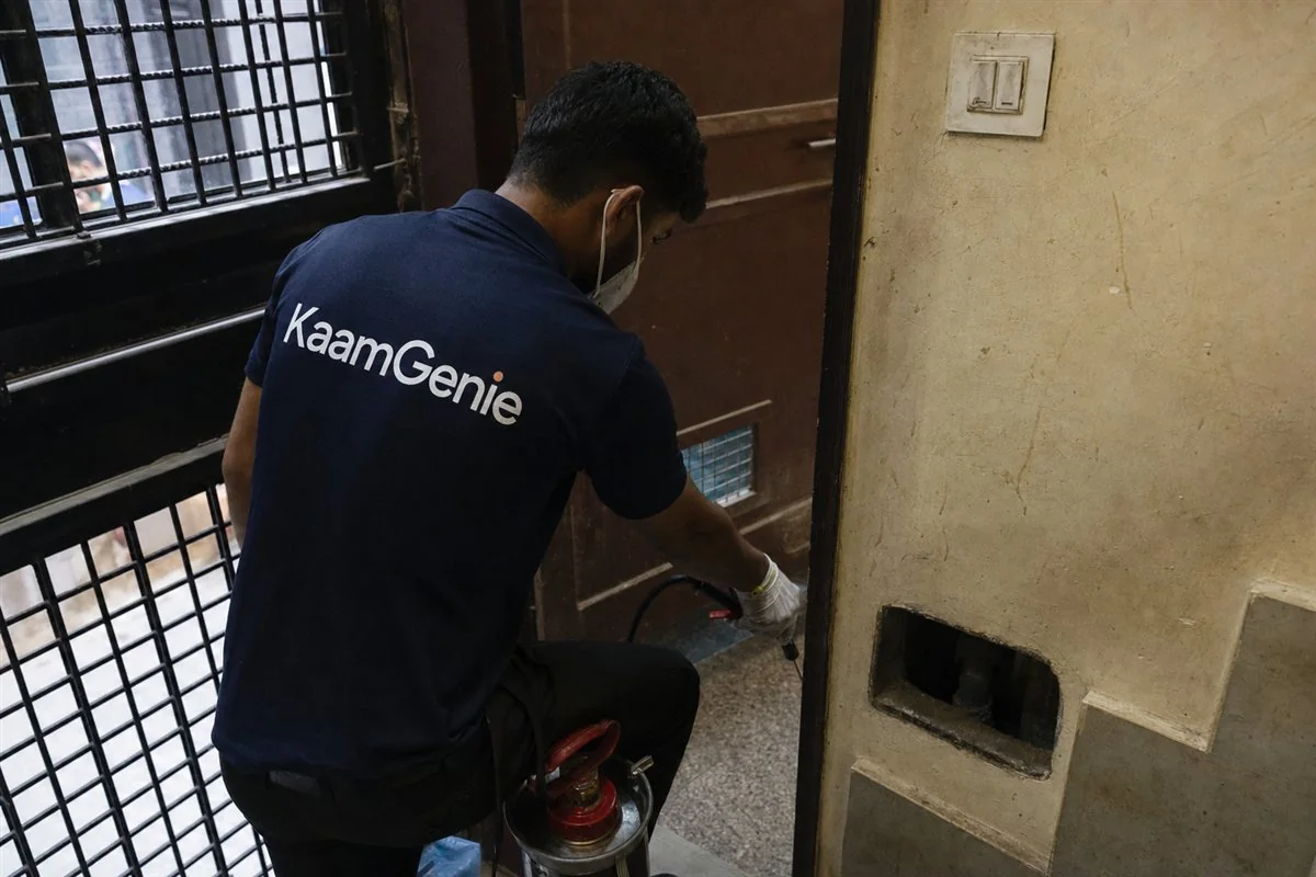 KaamGenie pest control technician treating a Jahangir Puri property in North-West Delhi