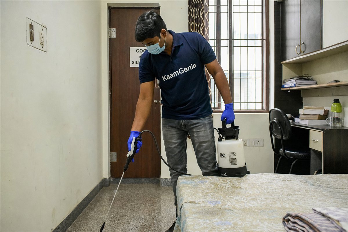KaamGenie pest control technician treating a student rental flat in Jamia Nagar, Okhla, South-East Delhi