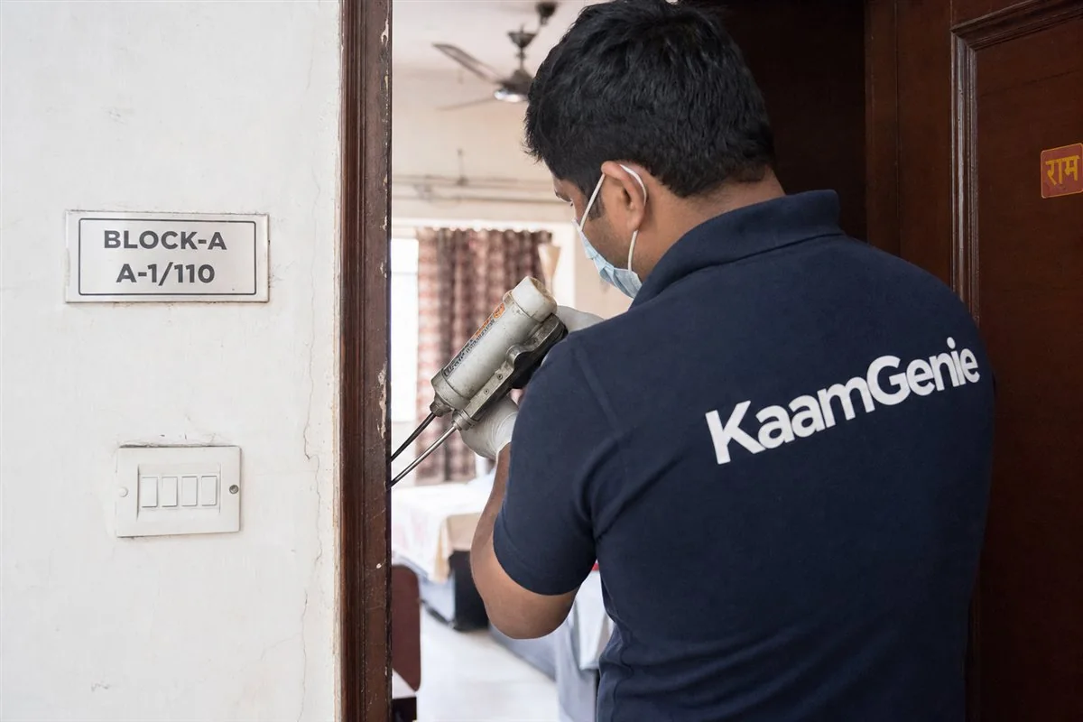 KaamGenie pest control technician treating a Janakpuri A Block property in West Delhi
