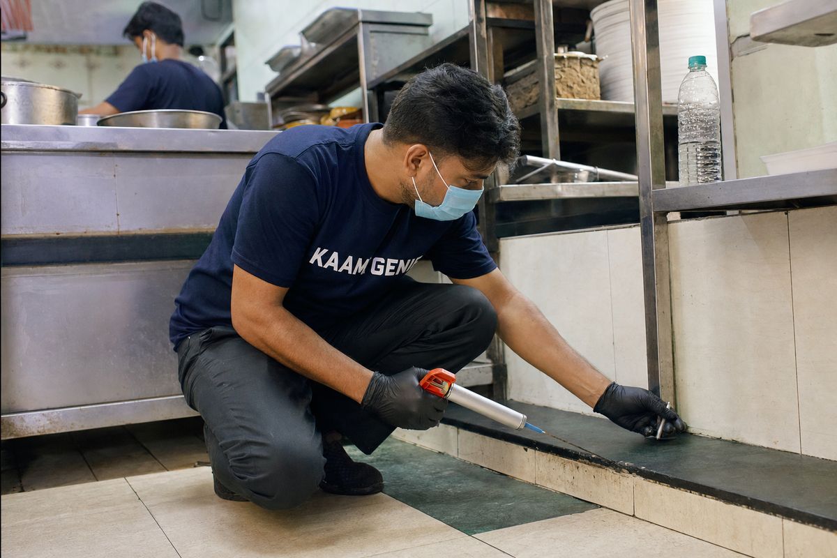 KaamGenie pest control technician treating a Kailash Colony property in South Delhi