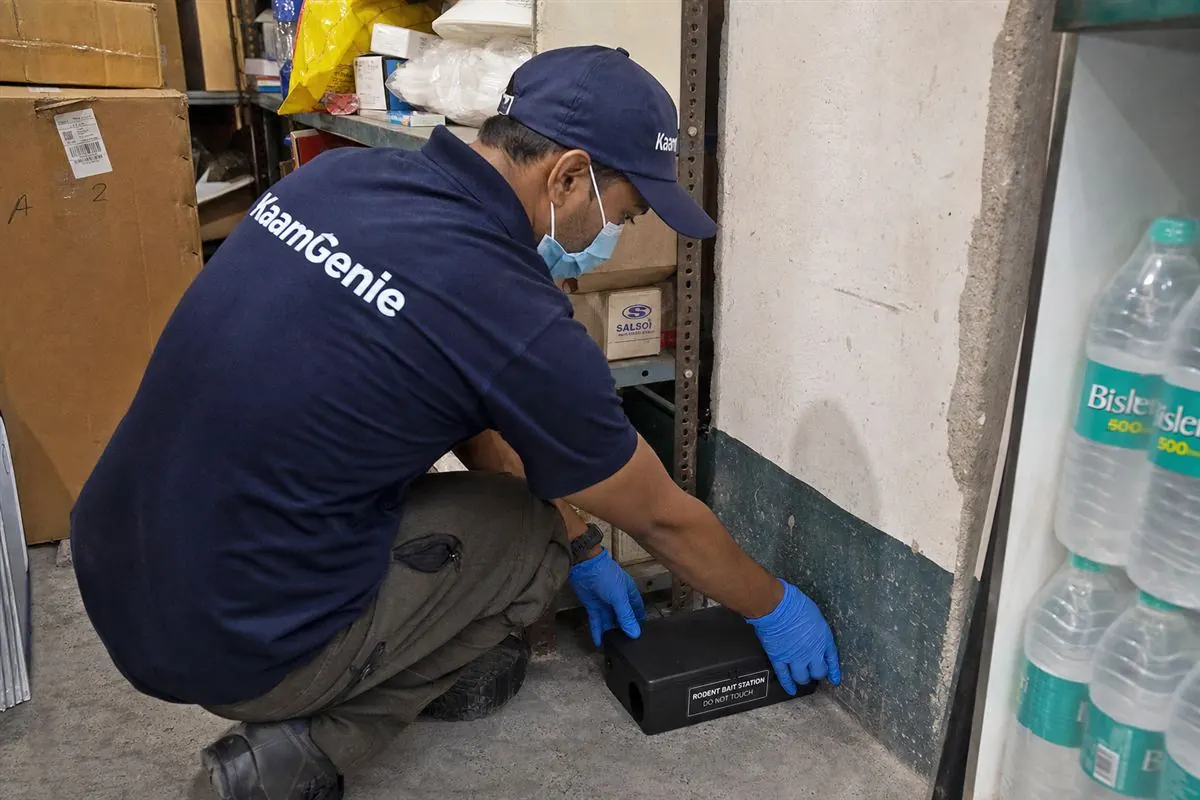 KaamGenie pest control technician treating a Kalyanpuri property in East Delhi