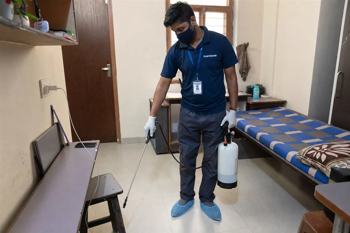 KaamGenie pest control technician treating a Kamla Nagar property in North Delhi / Central Delhi