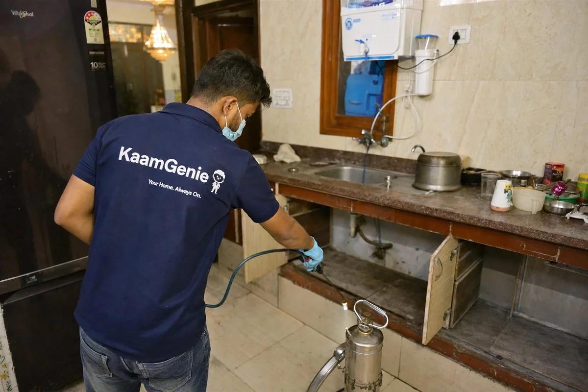 KaamGenie pest control technician treating a Karam Pura property in West Delhi