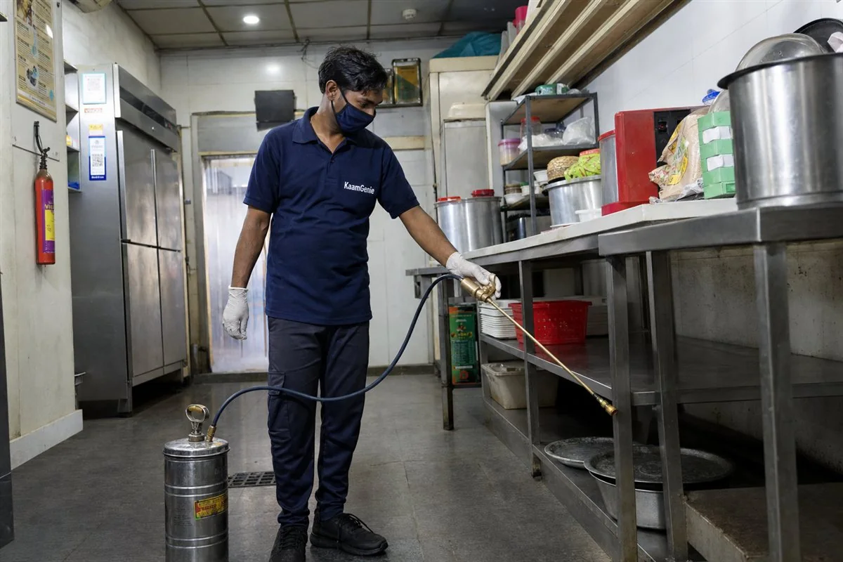 KaamGenie pest control technician treating a Karol Bagh property in Central Delhi