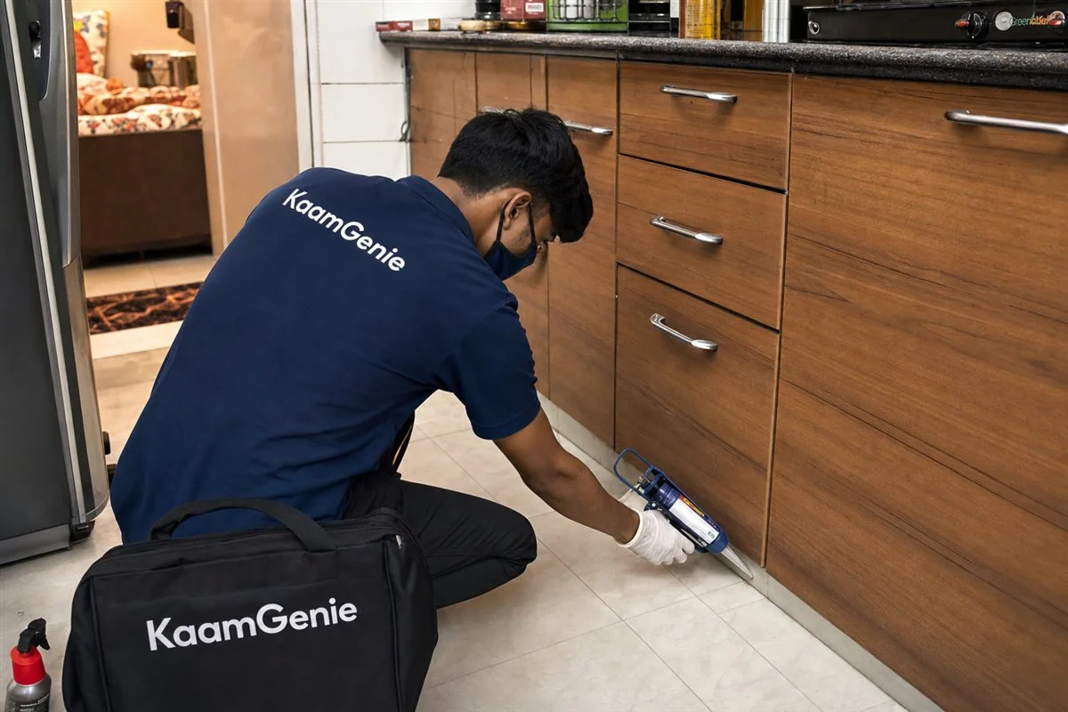 KaamGenie pest control technician treating a Khajoori Khas property in East Delhi