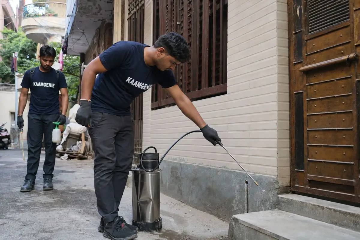 KaamGenie pest control technician treating a Kilokri property in South Delhi