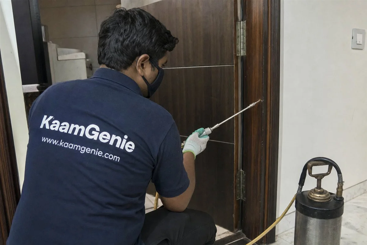 KaamGenie pest control technician treating a Kingsway Camp property in North & Central Delhi