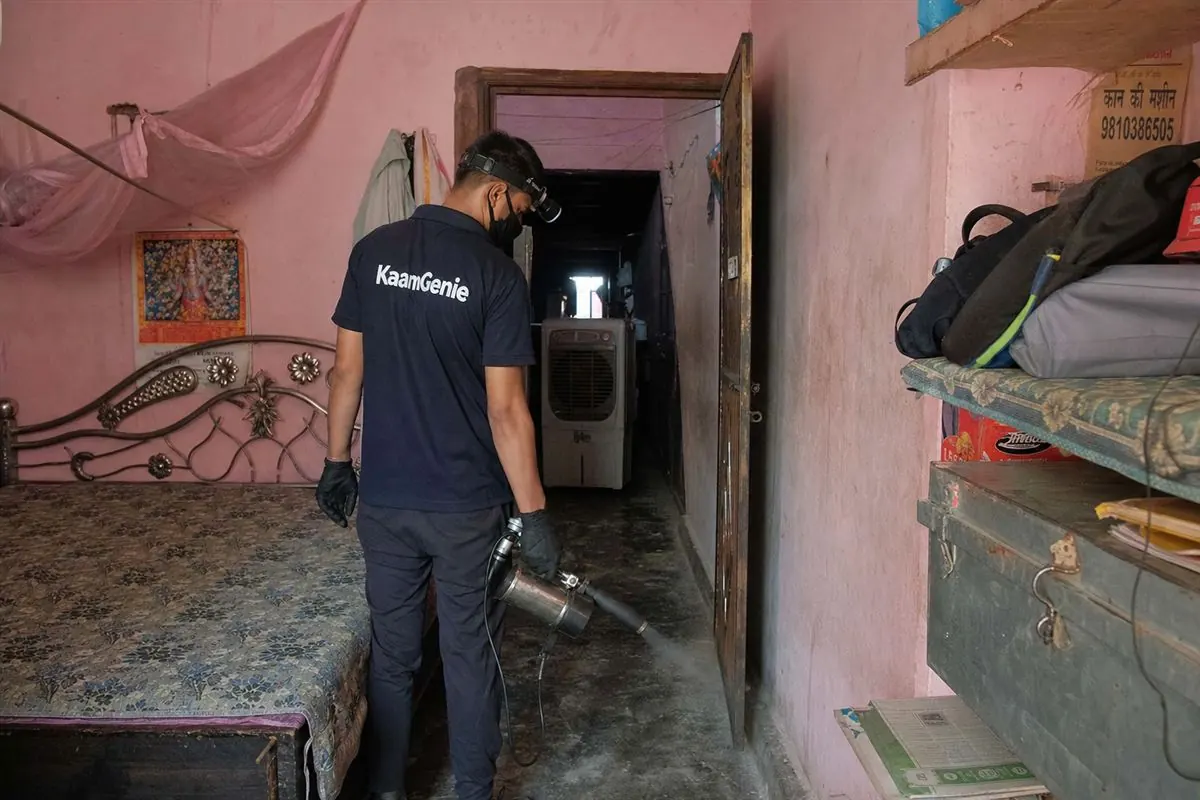 KaamGenie pest control technician treating a Kirari Suleman Nagar property in North-West Delhi