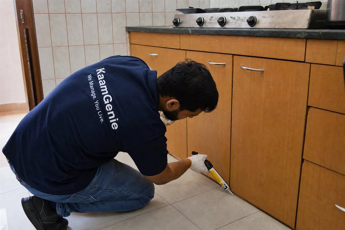 KaamGenie pest control technician treating a Kishangarh property in South Delhi