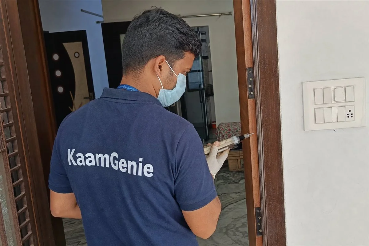 KaamGenie pest control technician treating a Krishna Nagar property in East Delhi