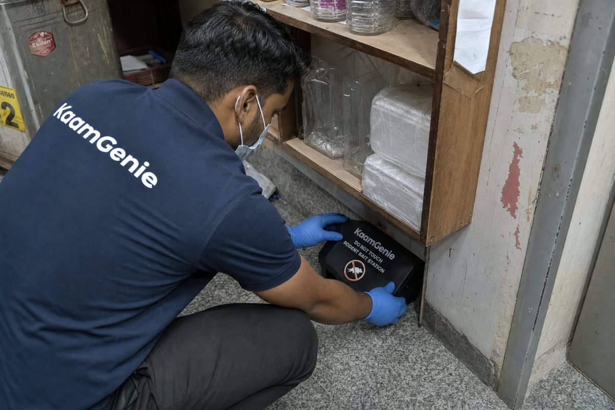 KaamGenie pest control technician treating a Laxmi Nagar property in East Delhi