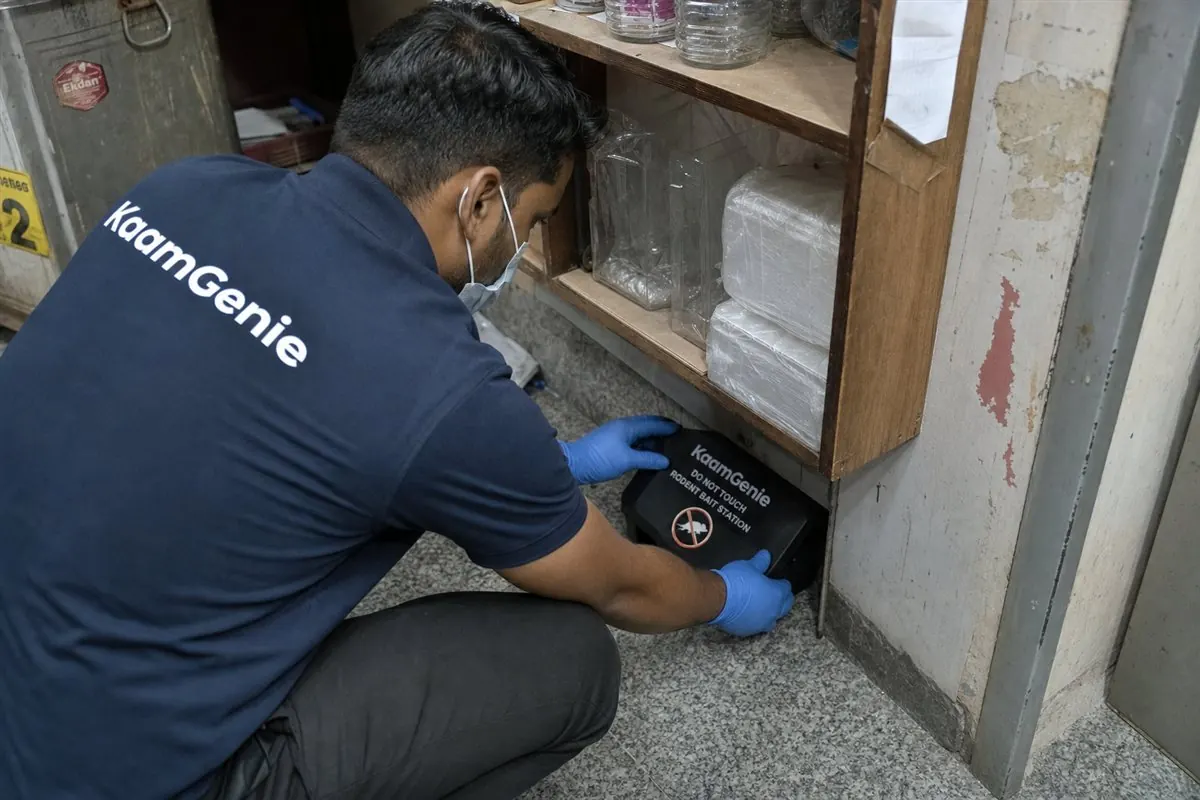 KaamGenie pest control technician treating a Laxmi Nagar property in East Delhi