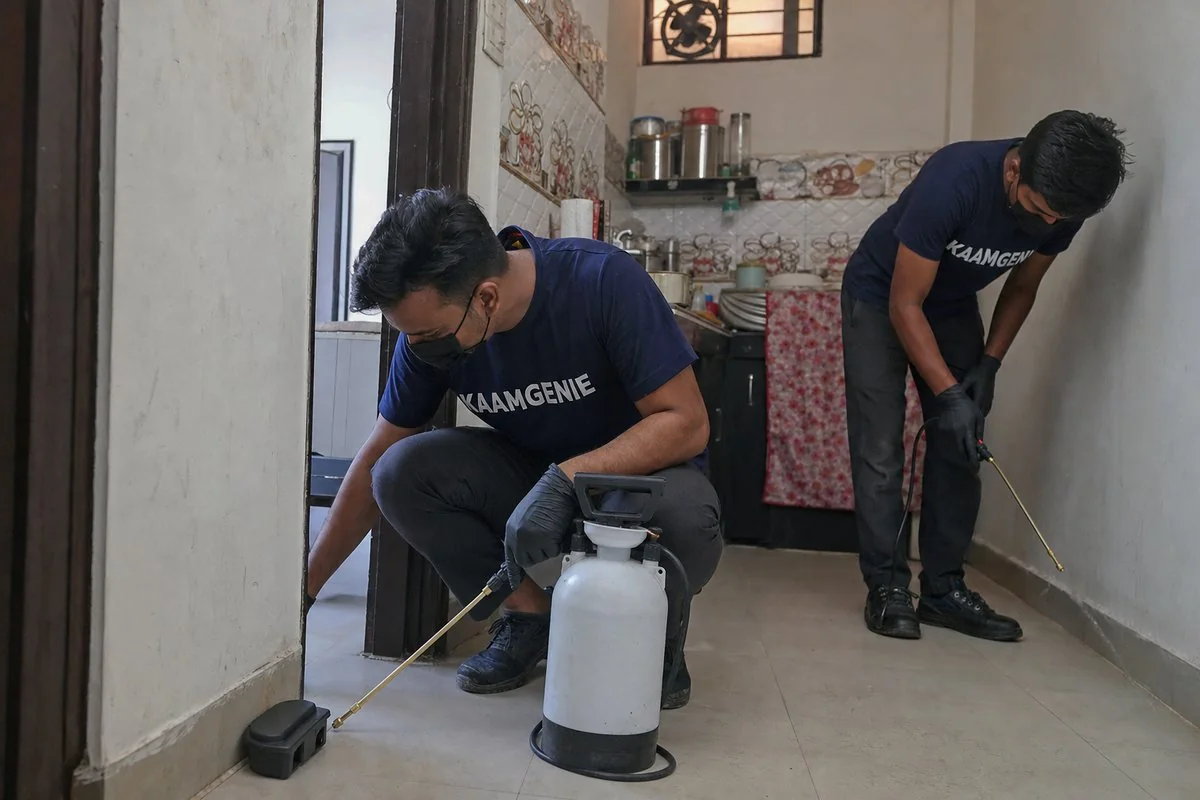 KaamGenie pest control technician treating a Madanpur Khadar property in South Delhi