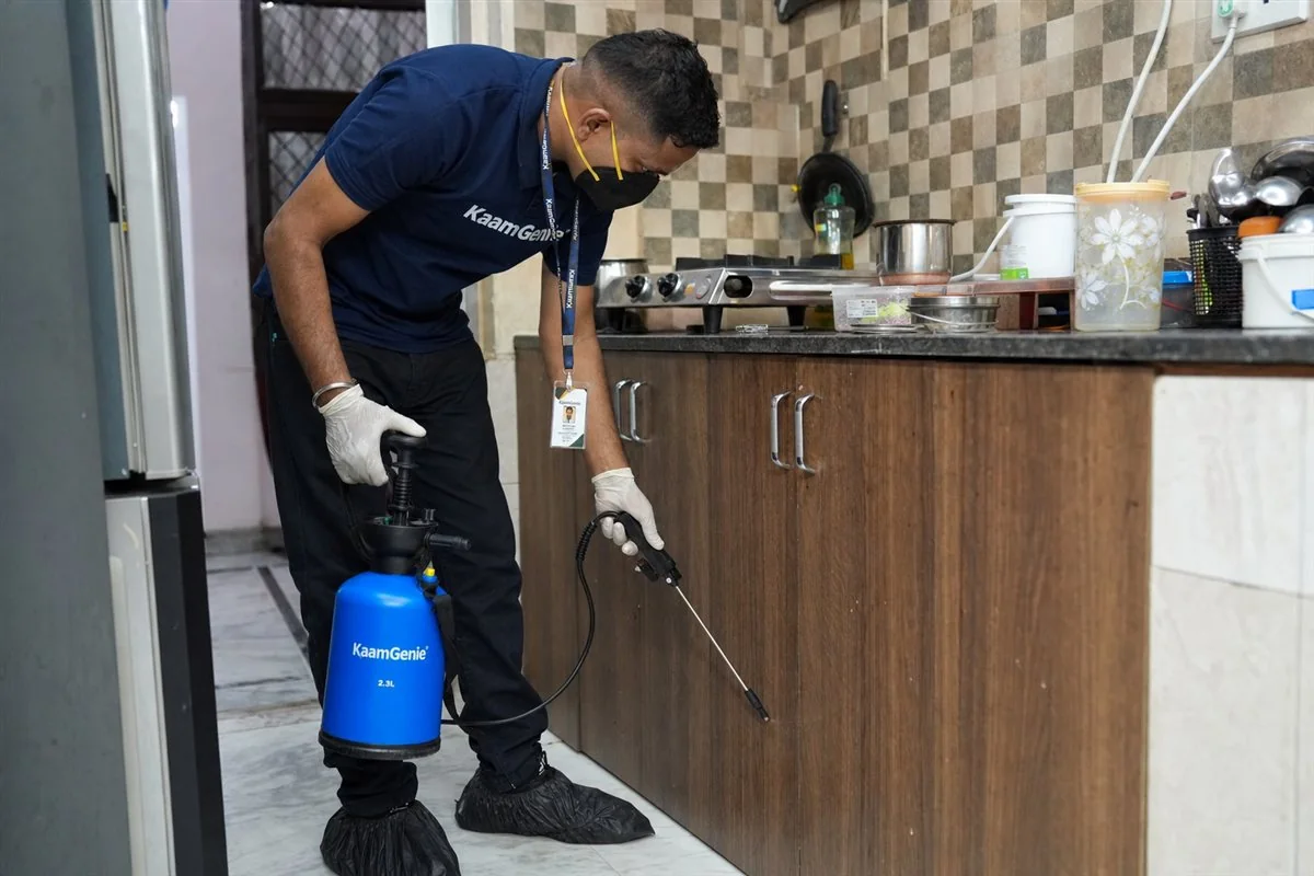 KaamGenie pest control technician treating a Mahabir Nagar property in West Delhi