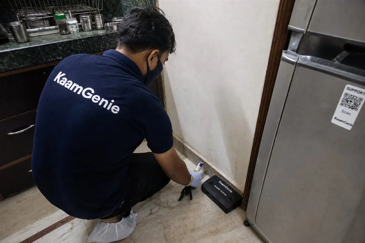 KaamGenie pest control technician treating a Mahavir Enclave property in South-West Delhi