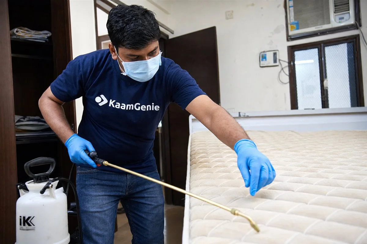 KaamGenie pest control technician treating a Mandawali Fazalpur property in East Delhi