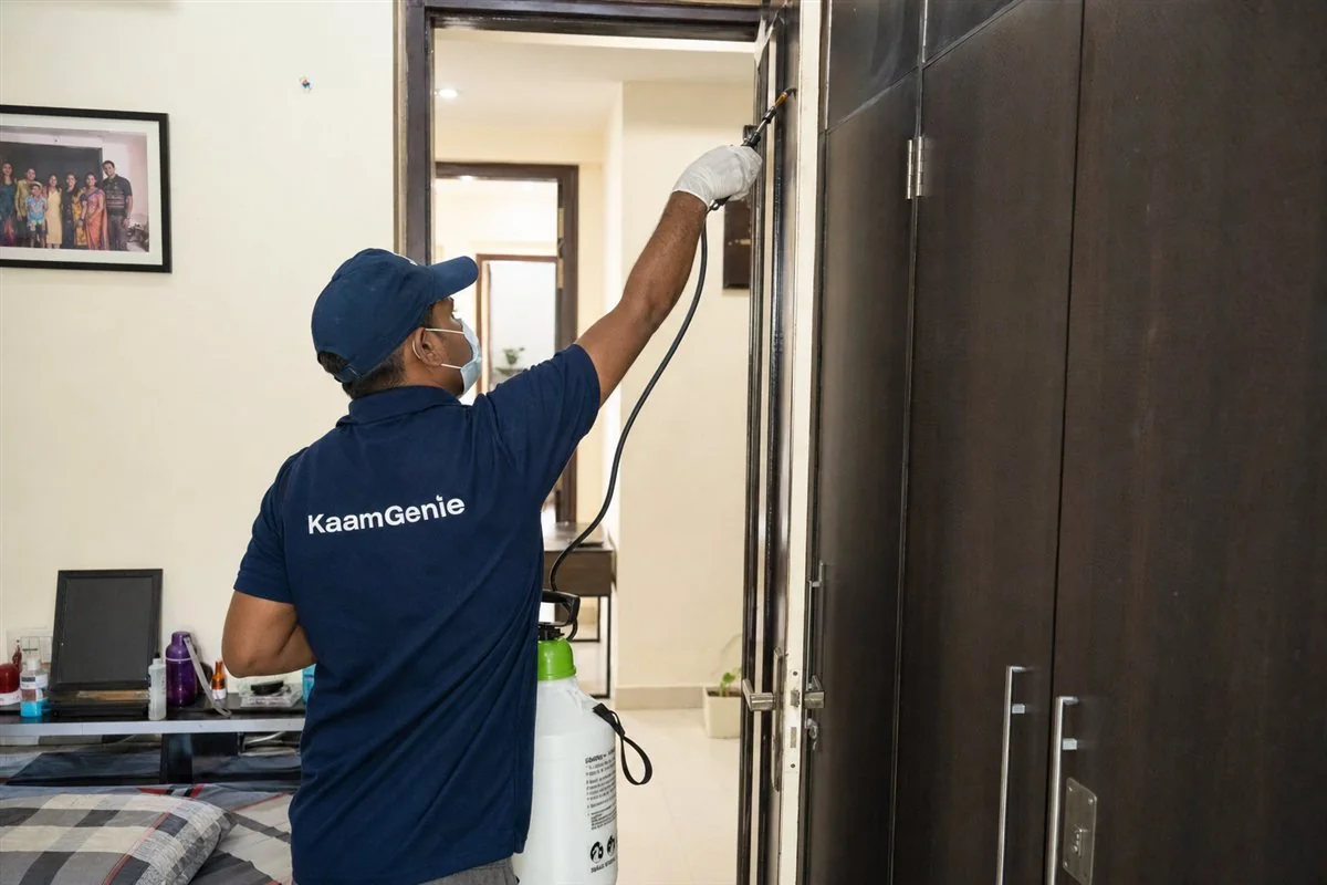 KaamGenie pest control technician treating a Maurya Enclave property in North-West Delhi