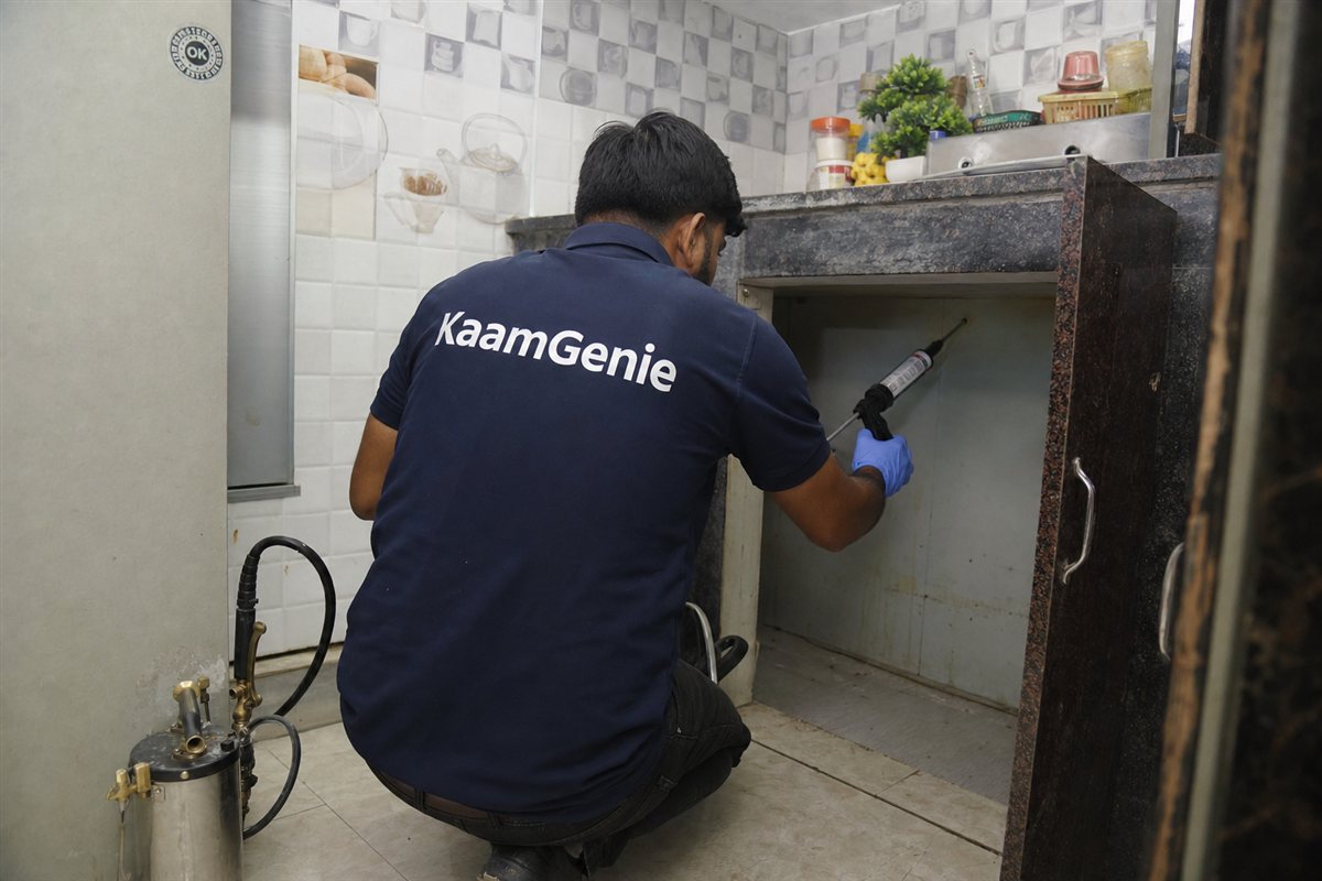 KaamGenie pest control technician treating a Mohan Garden property in West Delhi