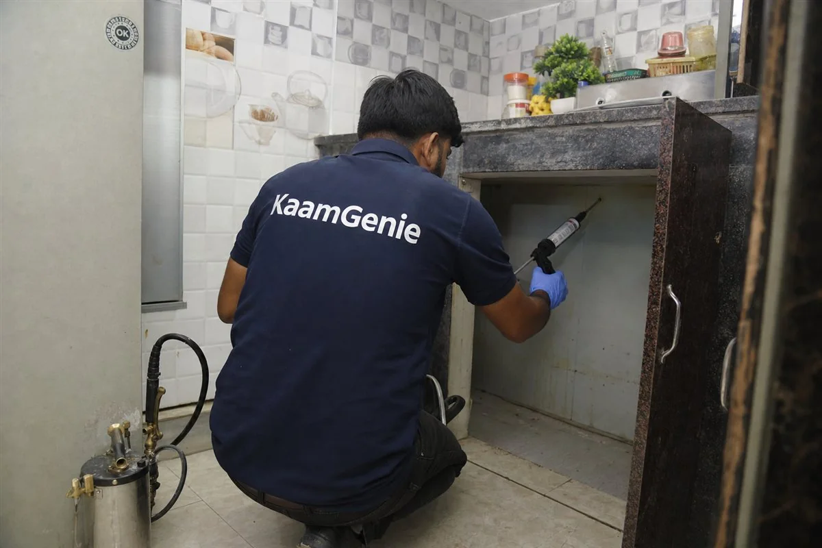 KaamGenie pest control technician treating a Mohan Garden property in West Delhi