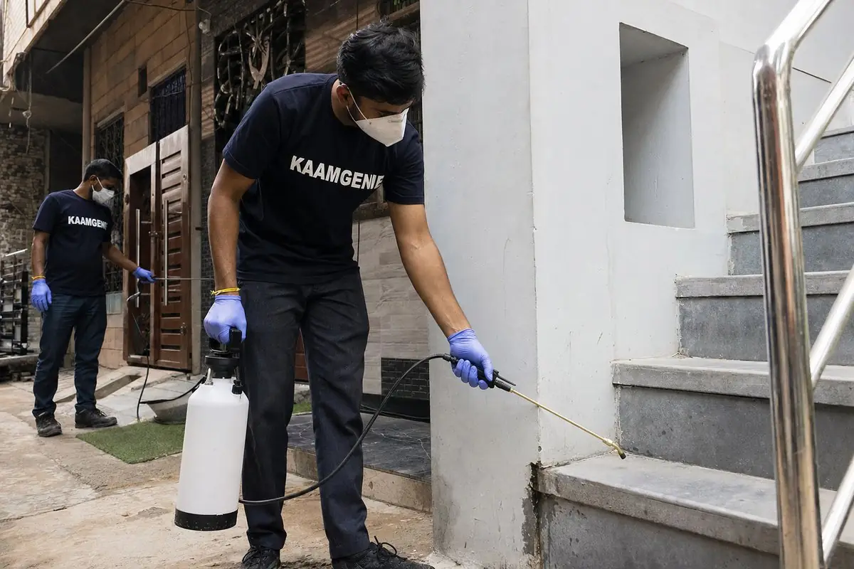 KaamGenie pest control technician treating a Molarband property in South Delhi