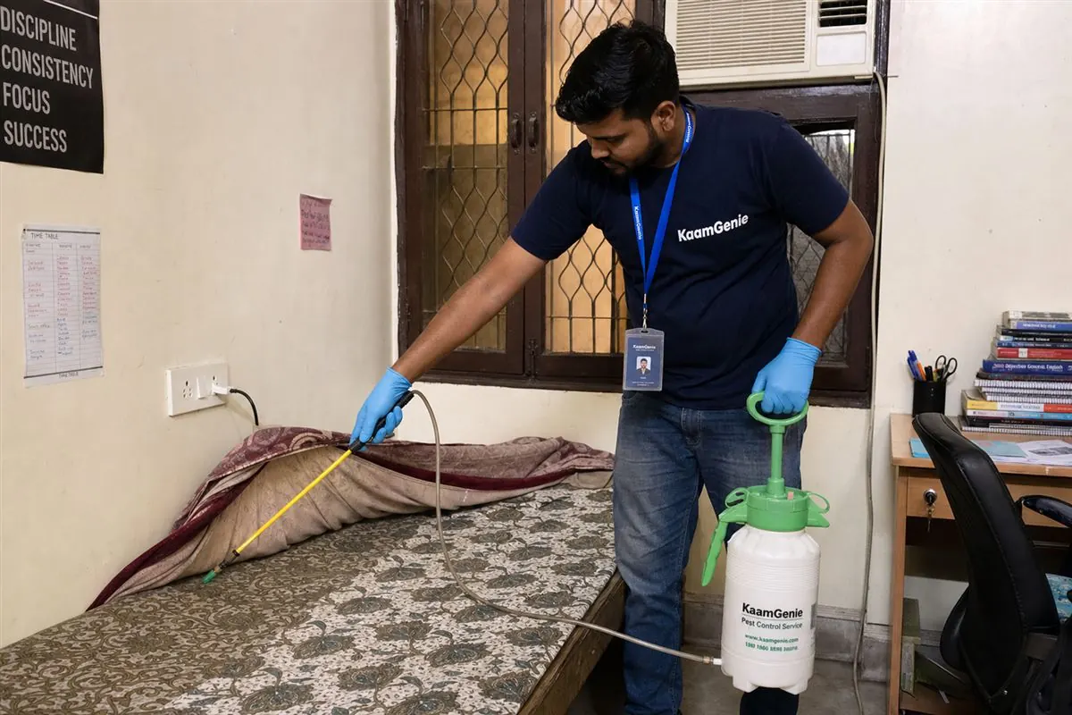 KaamGenie pest control technician treating a Mukherjee Nagar property in North Delhi / Central Delhi