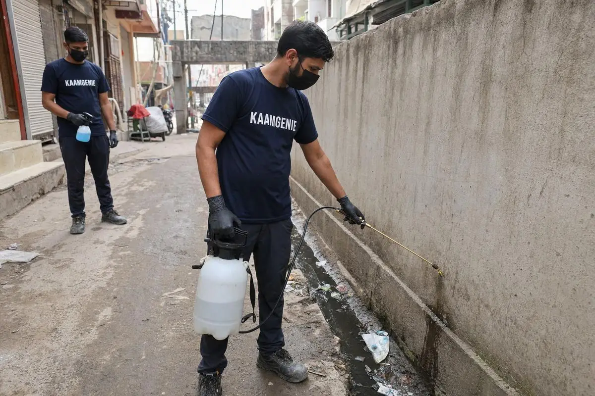 KaamGenie pest control technician treating a Mustafabad property in East Delhi
