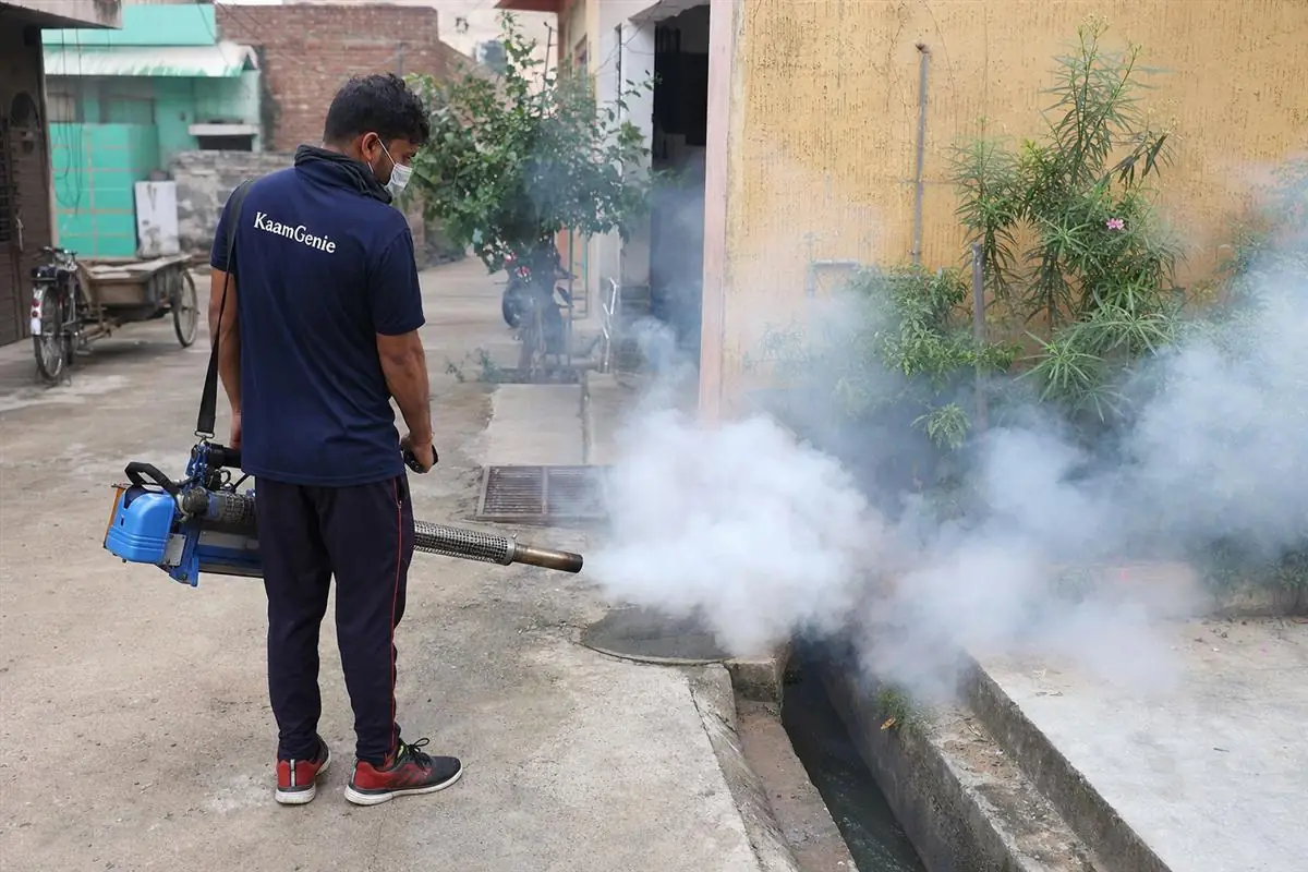 KaamGenie pest control technician treating a Najafgarh property in South-West Delhi